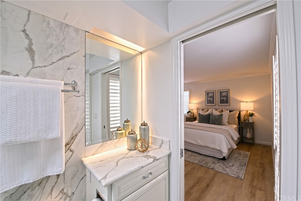 267 Avenida Lobeiro, Unit E San Clemente, CA 92672 - Photo 25 of 56 a en suite spacious bedroom with a bed and a dresser next to a window
