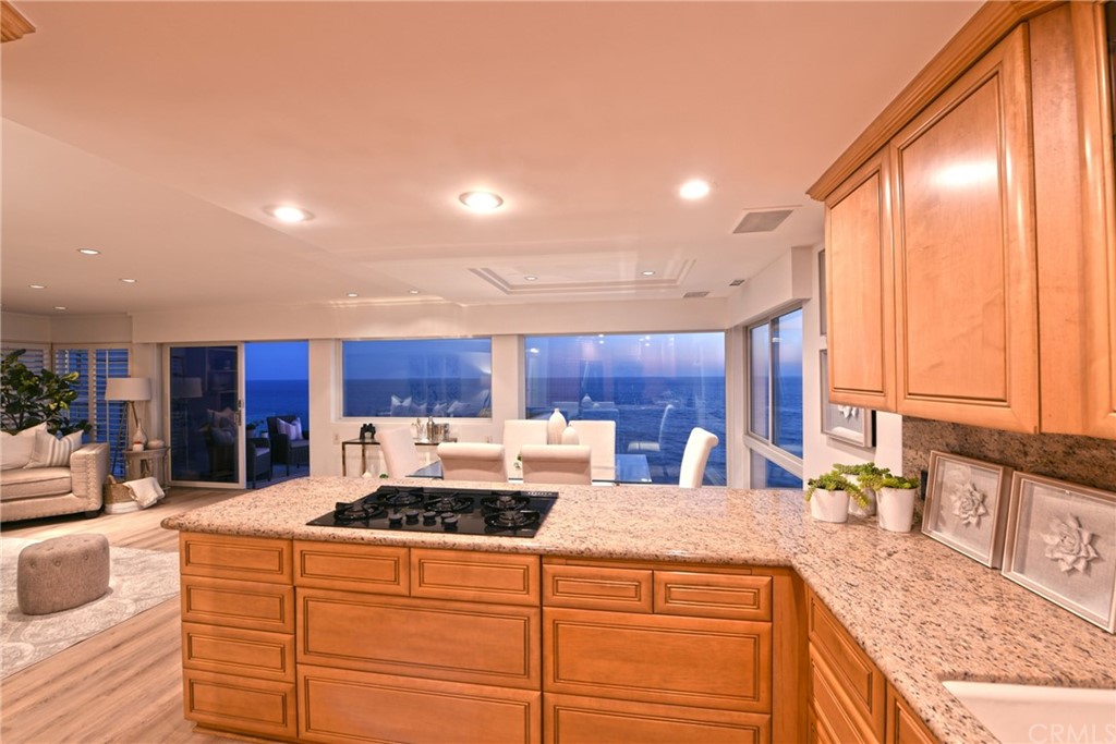 267 Avenida Lobeiro, Unit E San Clemente, CA 92672 - Photo 8 of 56 a kitchen with stainless steel appliances granite countertop a sink stove and cabinets