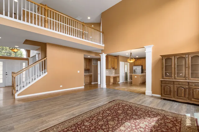 a view of an entryway with wooden floor