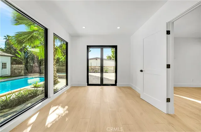a bathroom with a double vanity sink mirror and bathtub