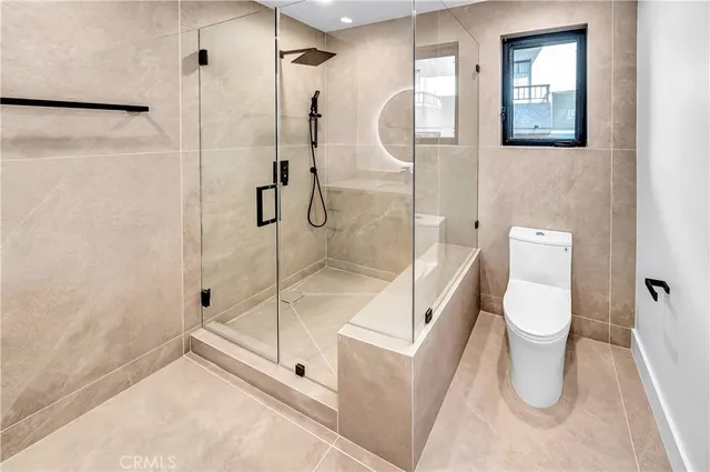 a view of a hallway with wooden floor and entryway