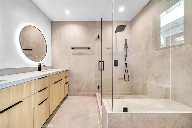 a view of a livingroom with an entryway and wooden floor