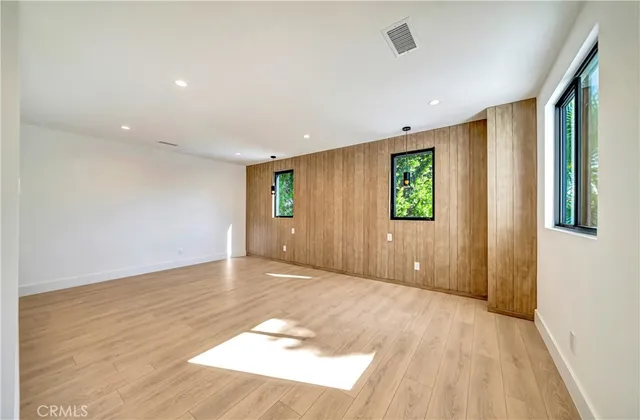 a bathroom with a double vanity sink mirror and bathtub