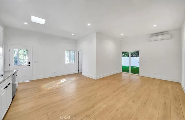 a view of a house with pool and a yard