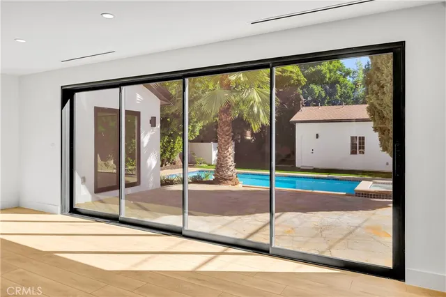 a view of a livingroom with furniture and an empty room