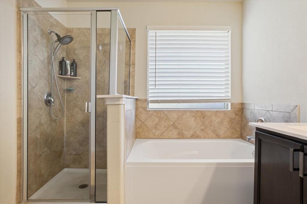 5308 Tama Drive Waco, TX 76708 - Photo 20 of 29 a bathroom with a bathtub and a shower