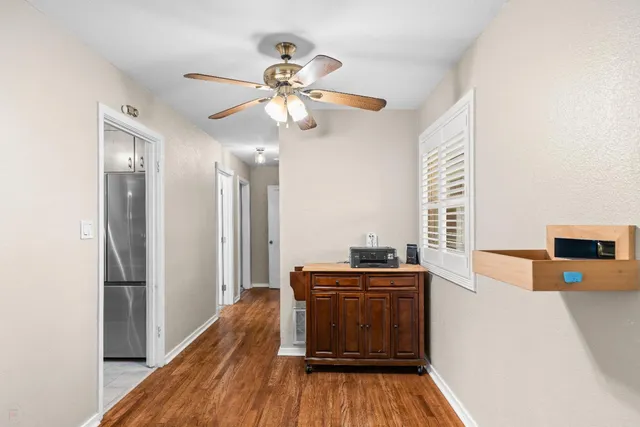 a kitchen with stainless steel appliances a refrigerator and a stove