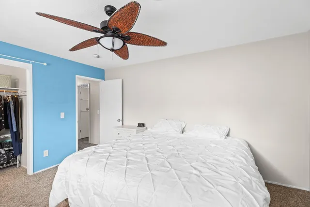 a bedroom with furniture and a window