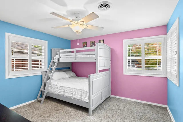 a room with a dresser and a mirror