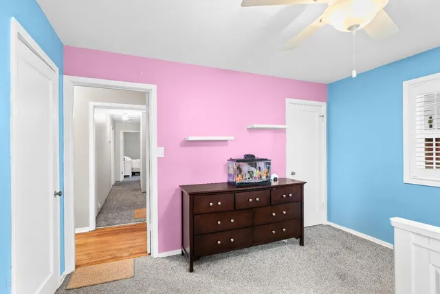 a view of a bathroom with washing machine and sink