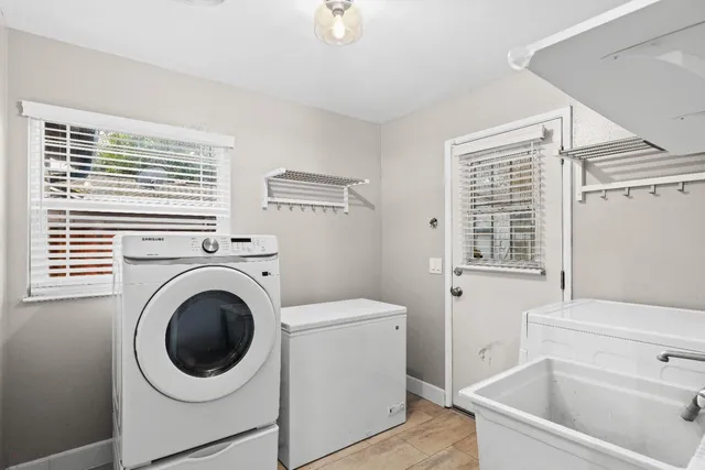 a view of backyard with a patio and outdoor seating