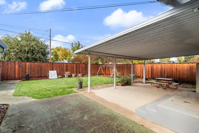 a view of yard with patio