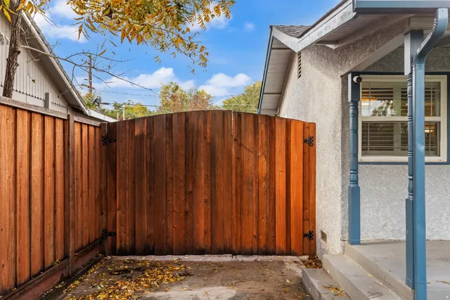 a view of a house with a yard and sitting area