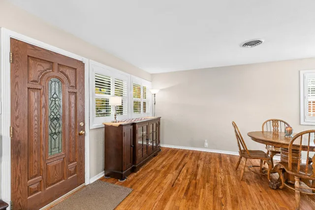 a view of a livingroom with furniture and wooden floor