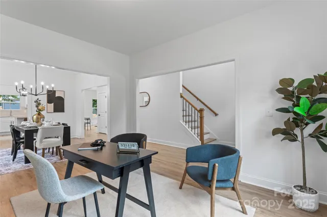 a view of a livingroom with furniture and a potted plant