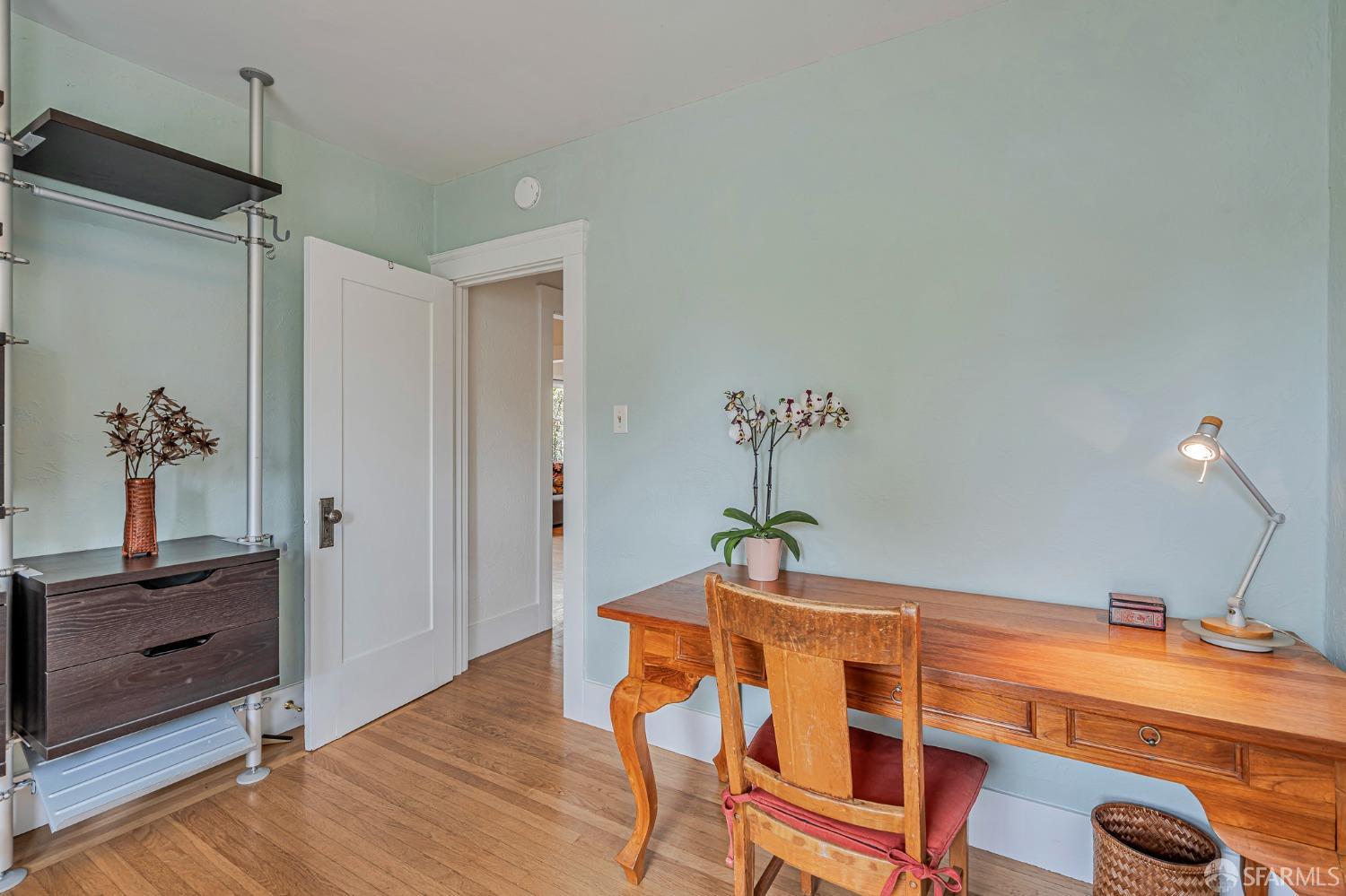2314 Edwards Street Berkeley, CA 94702 - Photo 20 of 39 a bedroom with a bed and wooden floor