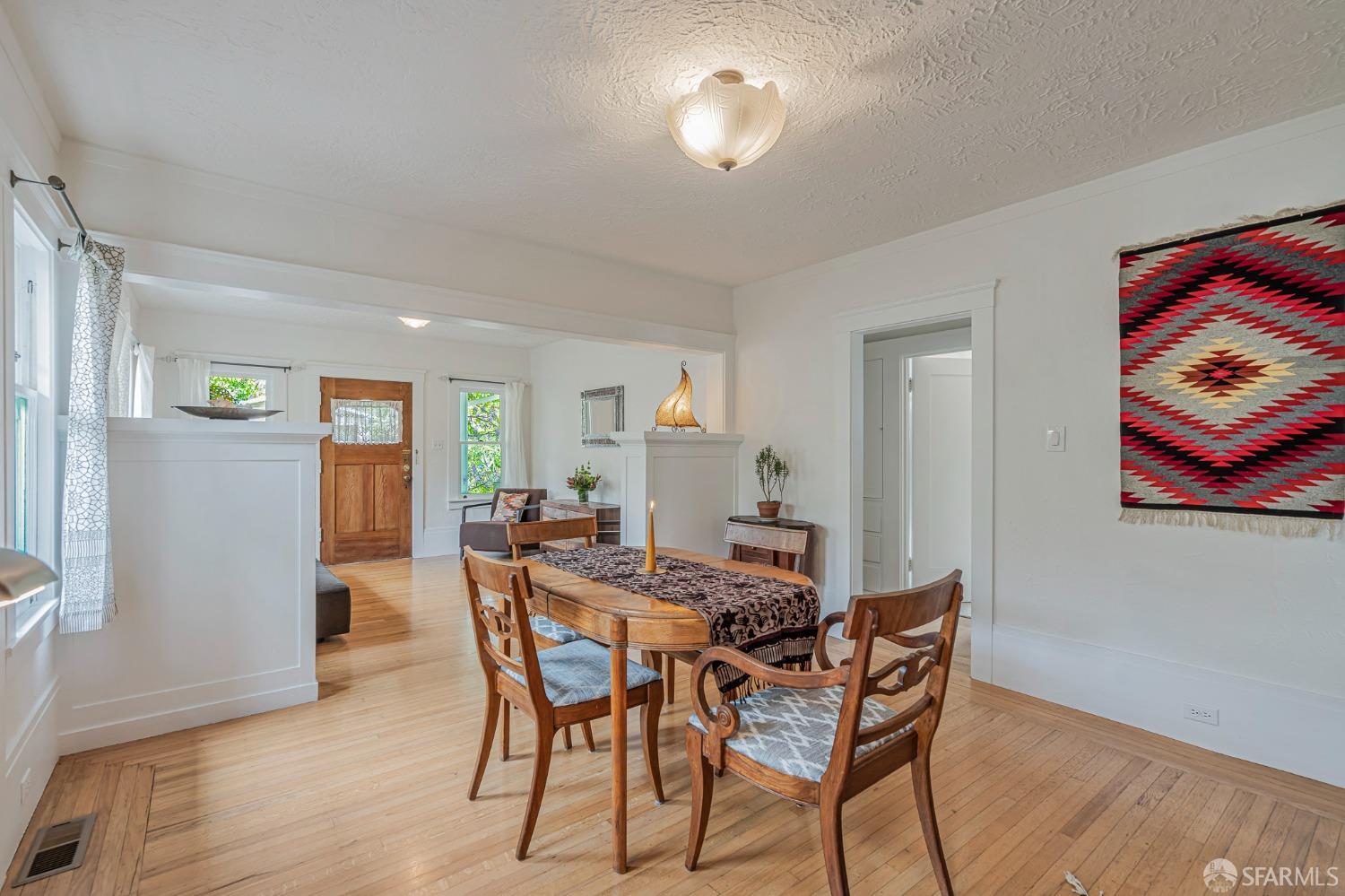 2314 Edwards Street Berkeley, CA 94702 - Photo 10 of 39 a view of a dining room with furniture and wooden floor