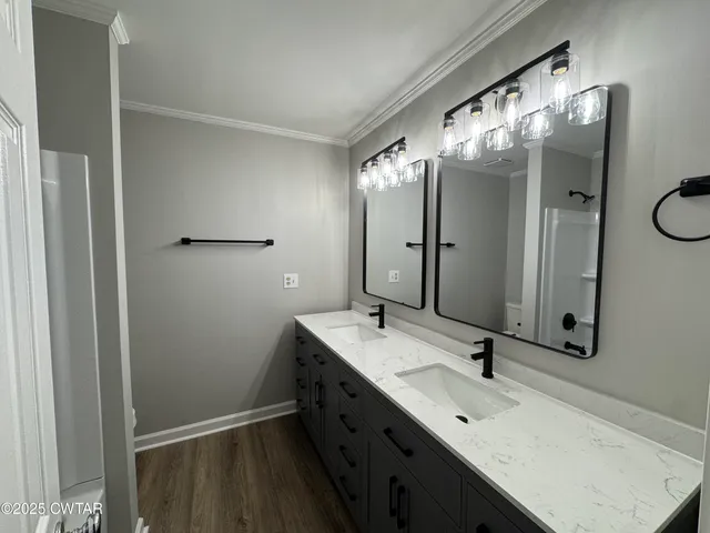 an empty room with a ceiling fan and window