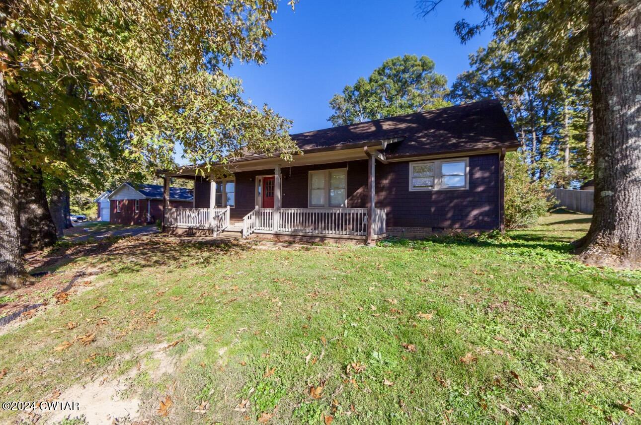 212 Fox Run Drive Jackson, TN 38305 - Photo 2 of 32 a house view with a garden space