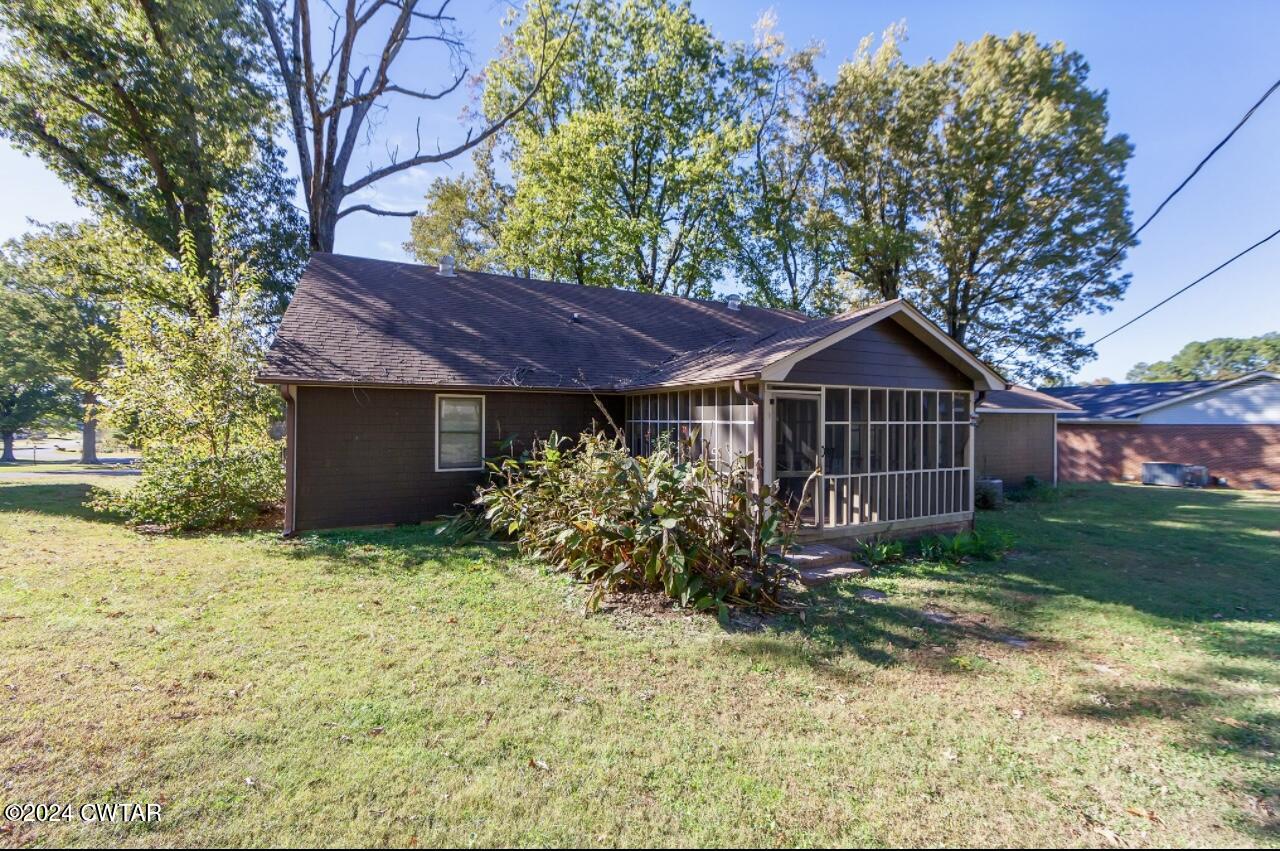212 Fox Run Drive Jackson, TN 38305 - Photo 29 of 32 a front view of house with yard and trees around