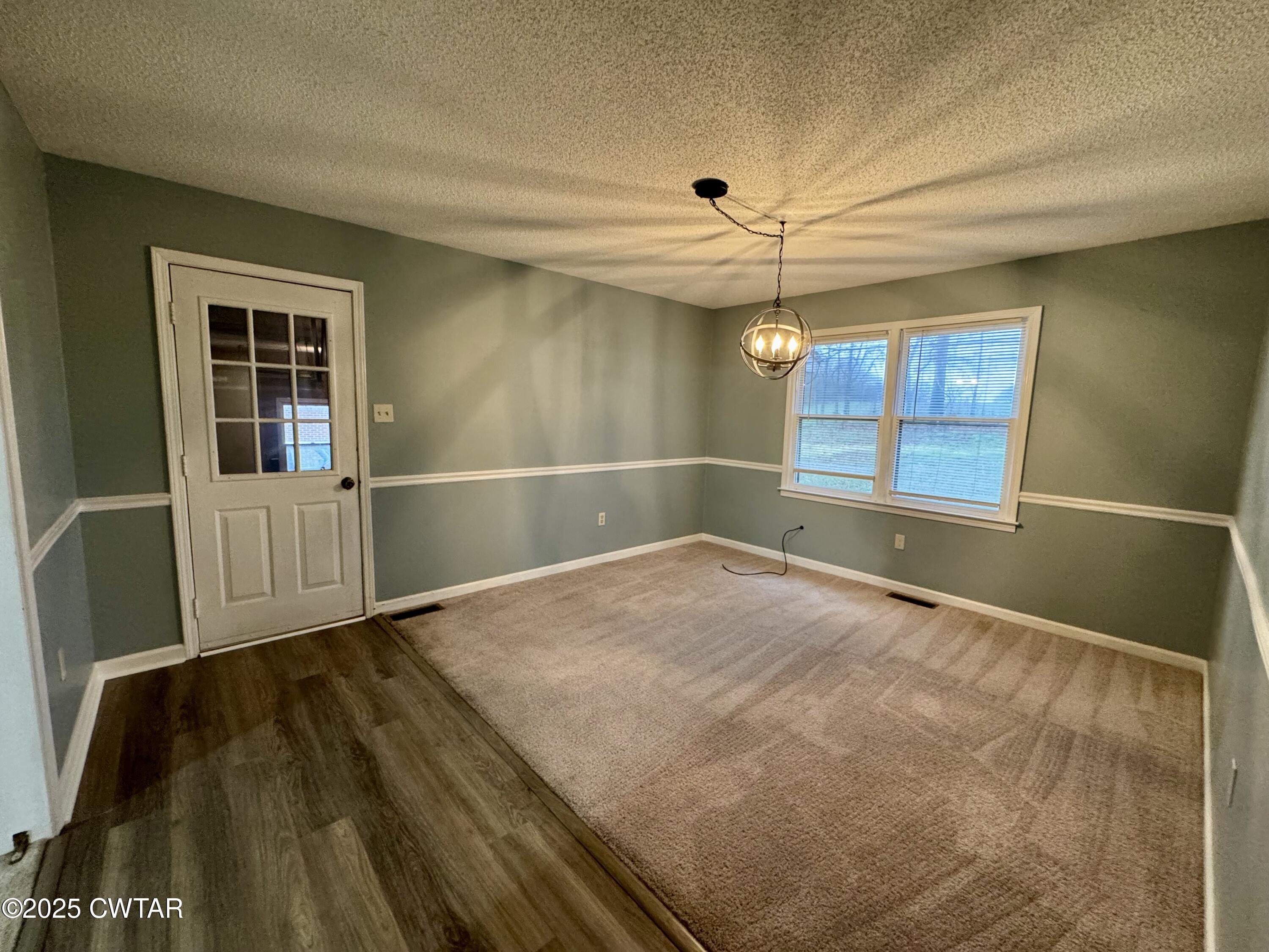 212 Fox Run Drive Jackson, TN 38305 - Photo 9 of 32 an empty room with windows and fan