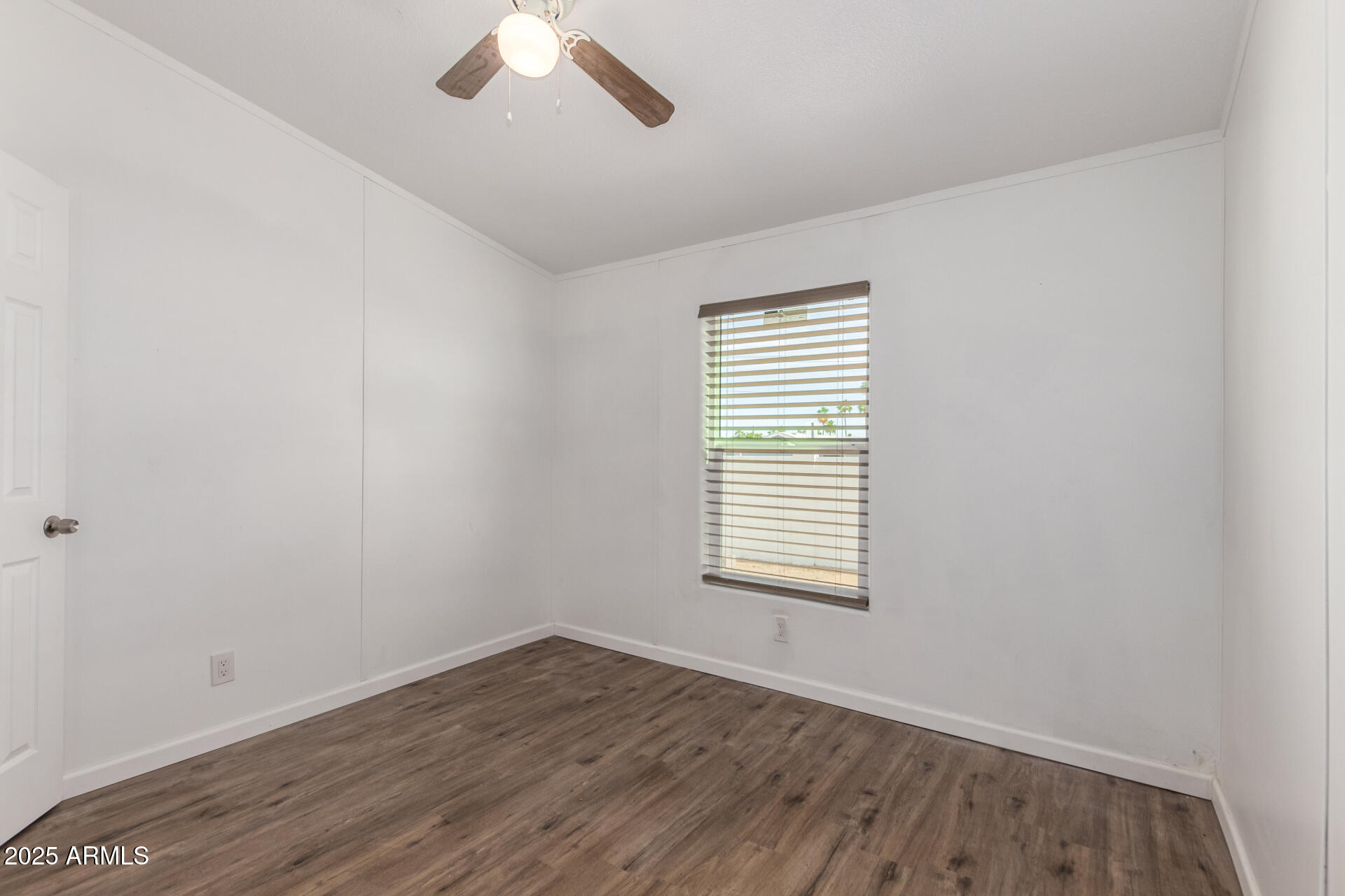 2388 South Vista Road Apache Junction, AZ 85119 - Photo 20 of 34 wooden floor in an empty room with a window