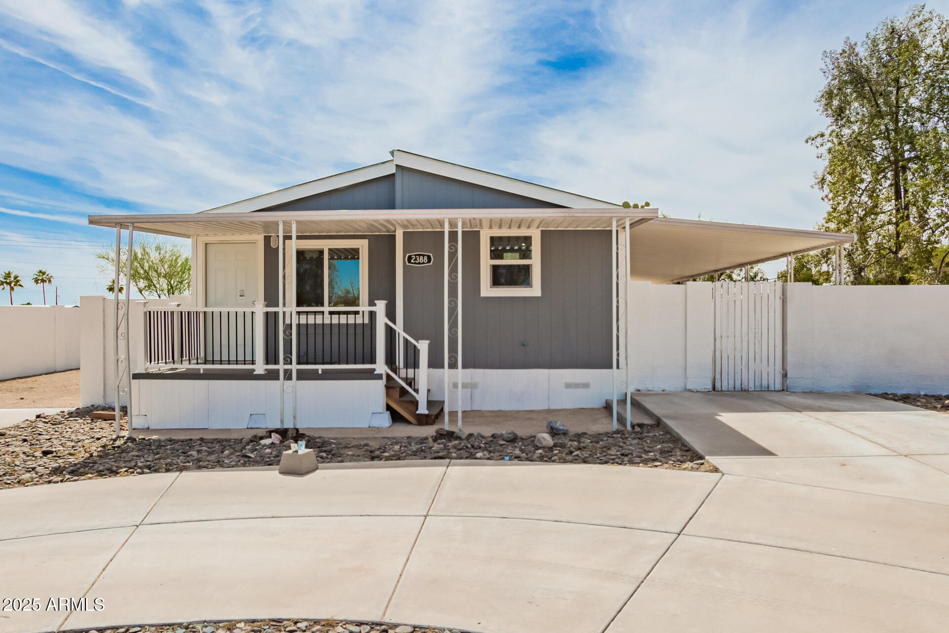 2388 South Vista Road Apache Junction, AZ 85119 - Photo 2 of 34 a front view of a house with a yard