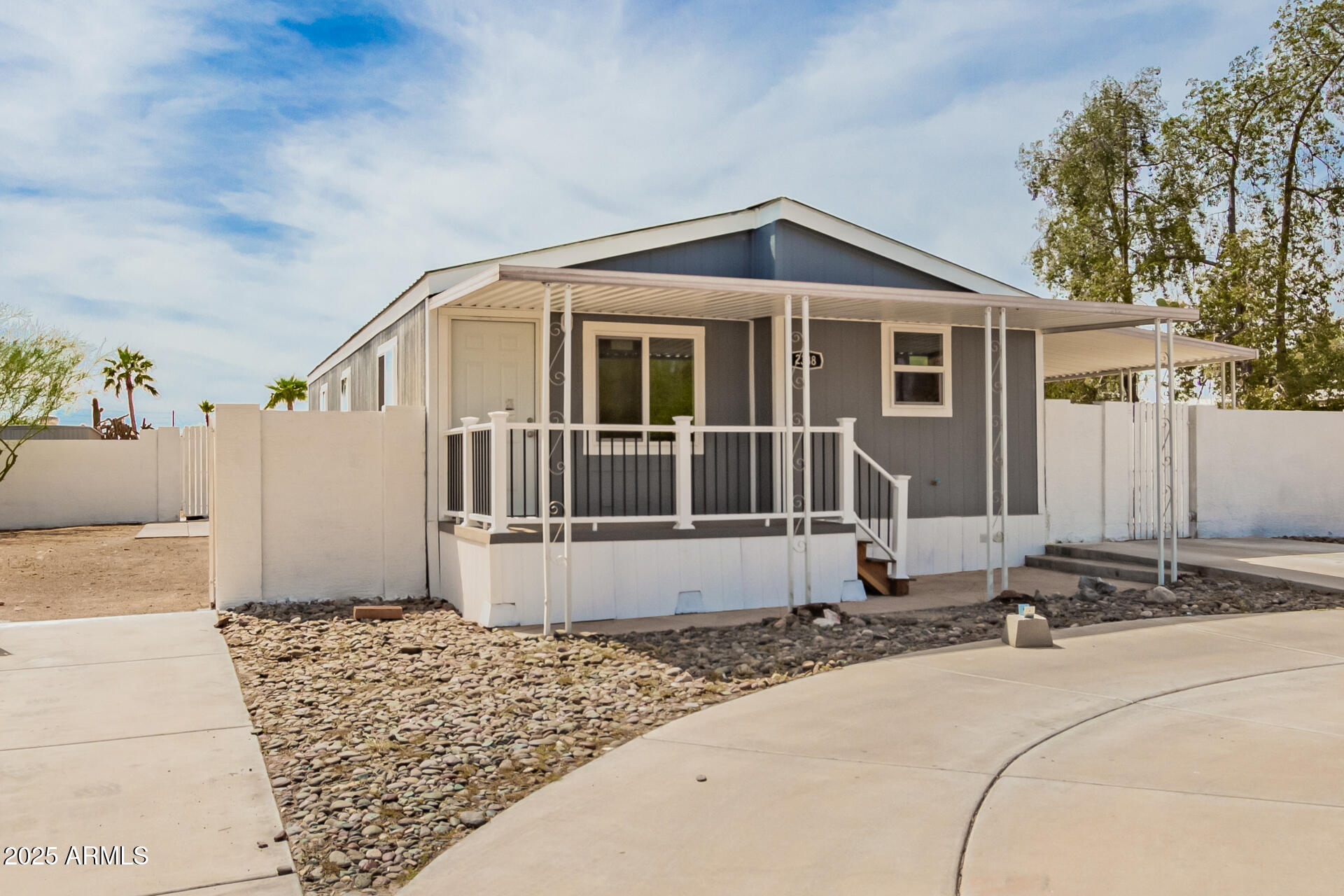 2388 South Vista Road Apache Junction, AZ 85119 - Photo 4 of 34 a front view of a house with a yard