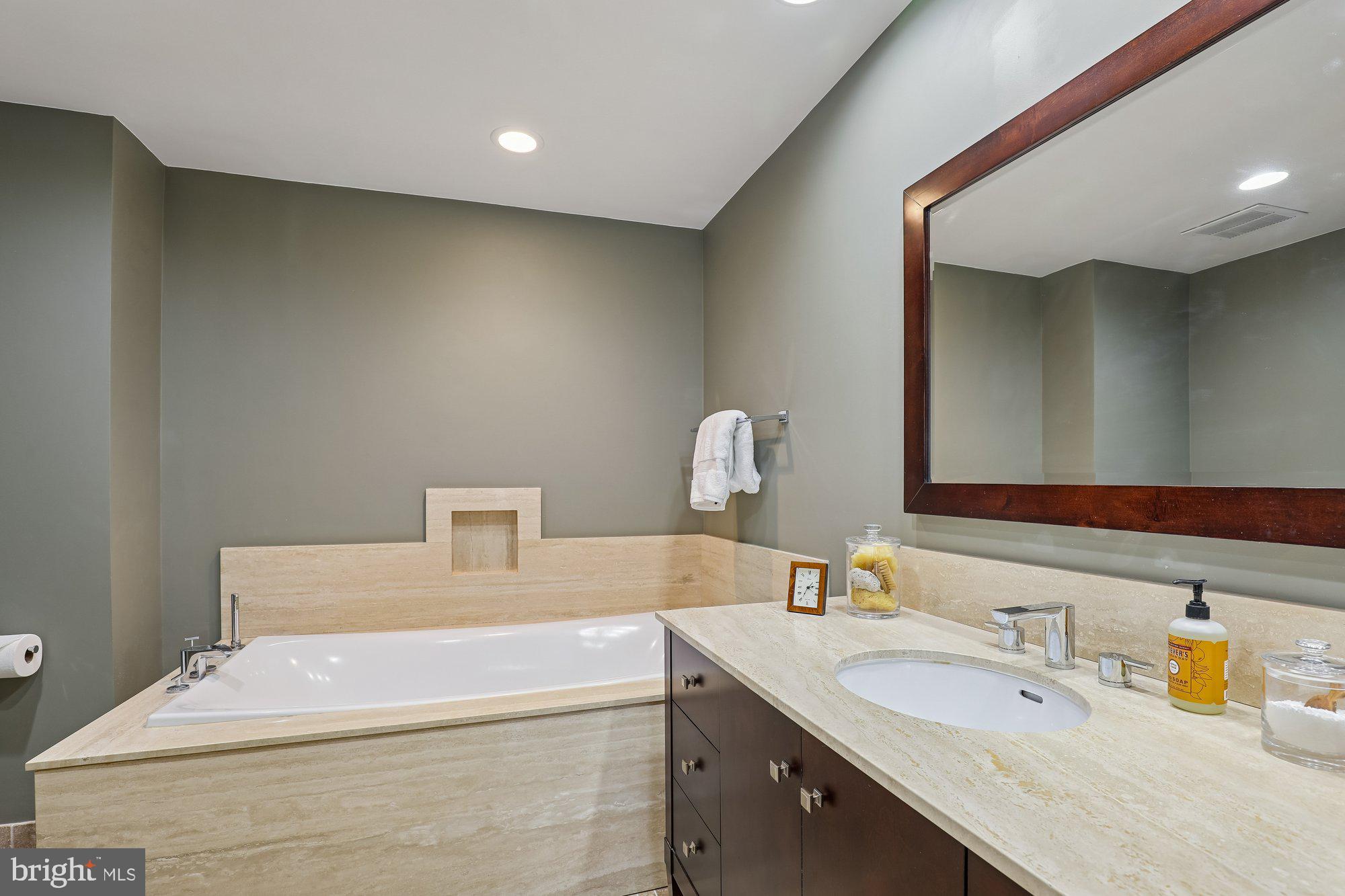 8019 Galla Knoll Circle Springfield, VA 22153 - Photo 29 of 57 a bathroom with a sink vanity and a mirror