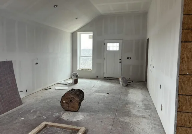 a room with window and a rug