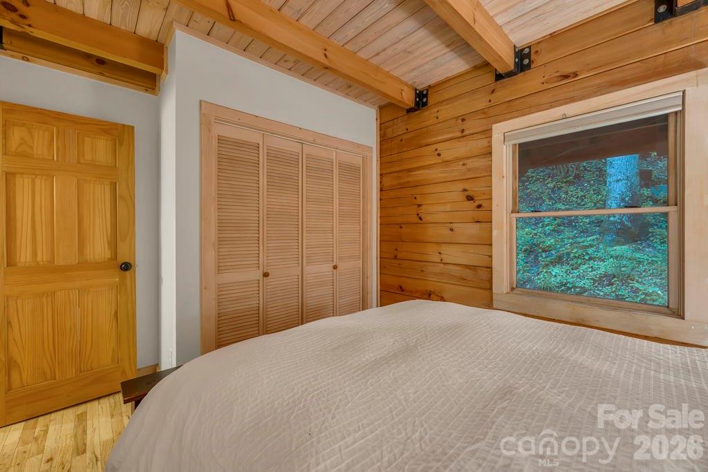 192 Dewitt Barnett Road, Unit 2 Vilas, NC 28692 - Photo 19 of 32 a bedroom with a bed and a window
