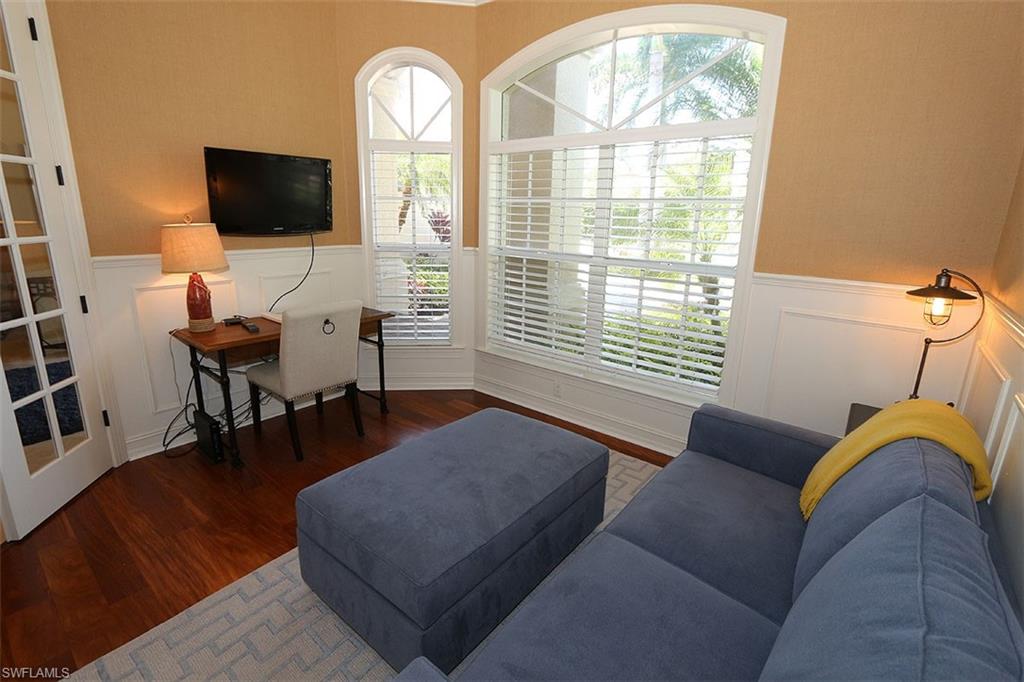 1824 Crayton Road Naples, FL 34102 - Photo 14 of 37 a living room with furniture and a flat screen tv