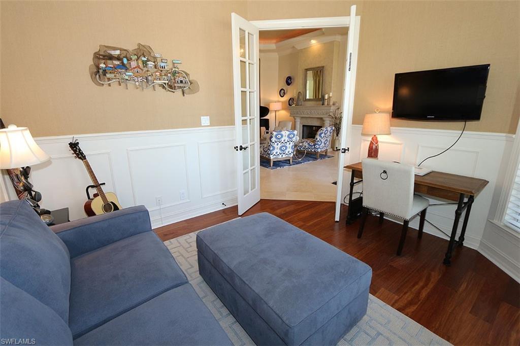 1824 Crayton Road Naples, FL 34102 - Photo 15 of 37 a living room with furniture and a flat screen tv