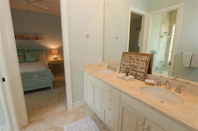 a en suite bathroom with a sink and a mirror