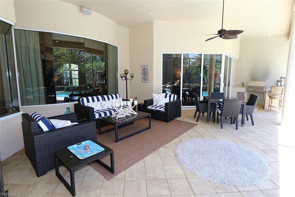 1824 Crayton Road Naples, FL 34102 - Photo 30 of 37 a living room with furniture and a large window