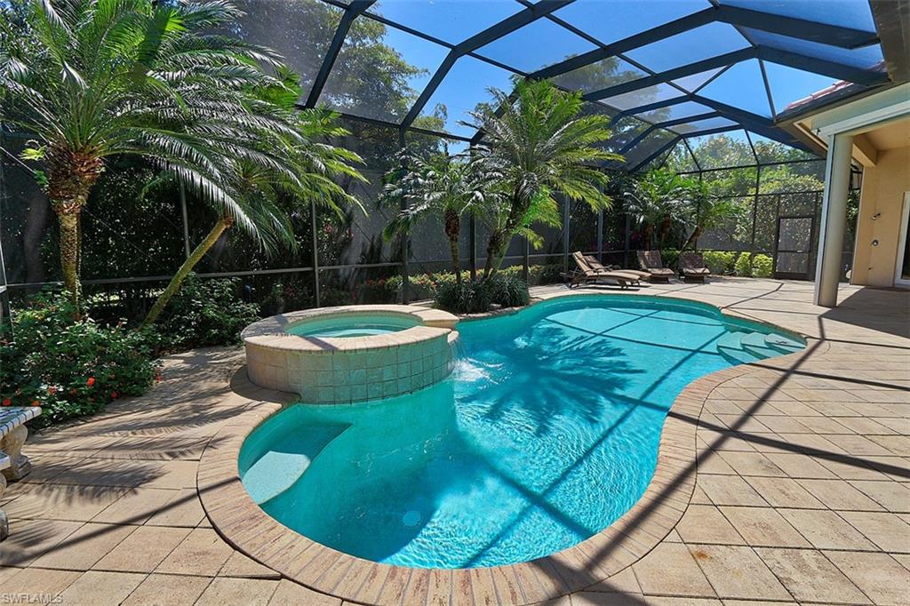 1824 Crayton Road Naples, FL 34102 - Photo 34 of 37 a view of a swimming pool with a patio