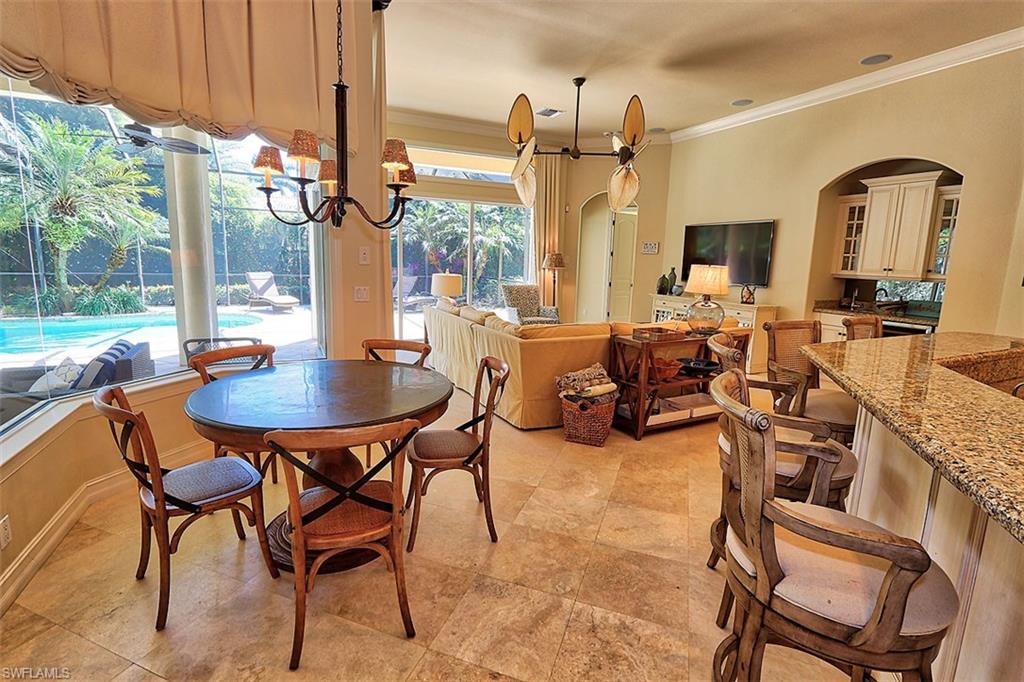 1824 Crayton Road Naples, FL 34102 - Photo 10 of 37 a outdoor space with lots of furniture and chandelier