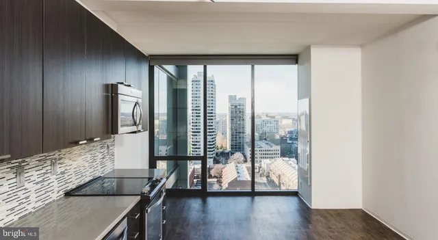 a view of a living room and floor to ceiling window