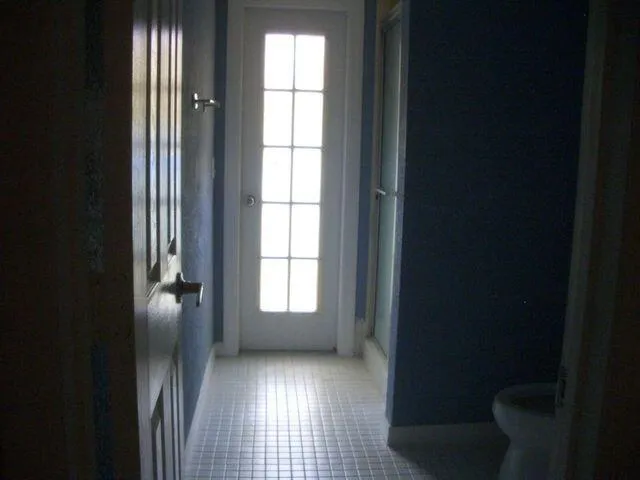 a view of an empty room and window