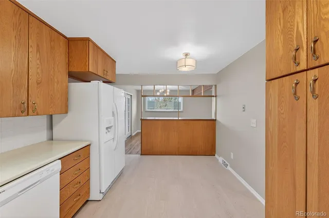 a view of a room with wooden floor and window