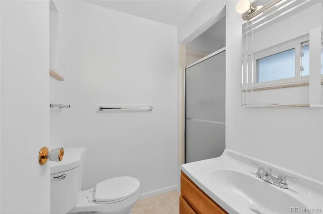 a view of room with window and wooden floor