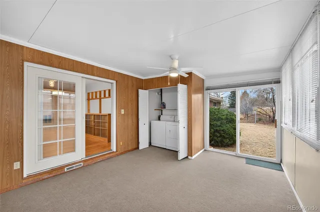 a view of a hallway with wooden floor and entryway