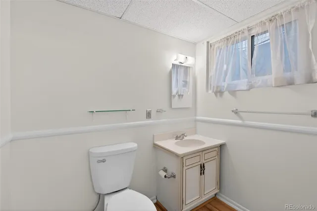 a kitchen with a stove and a white cabinets
