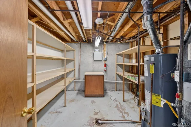 a white house that has a tree in front of it