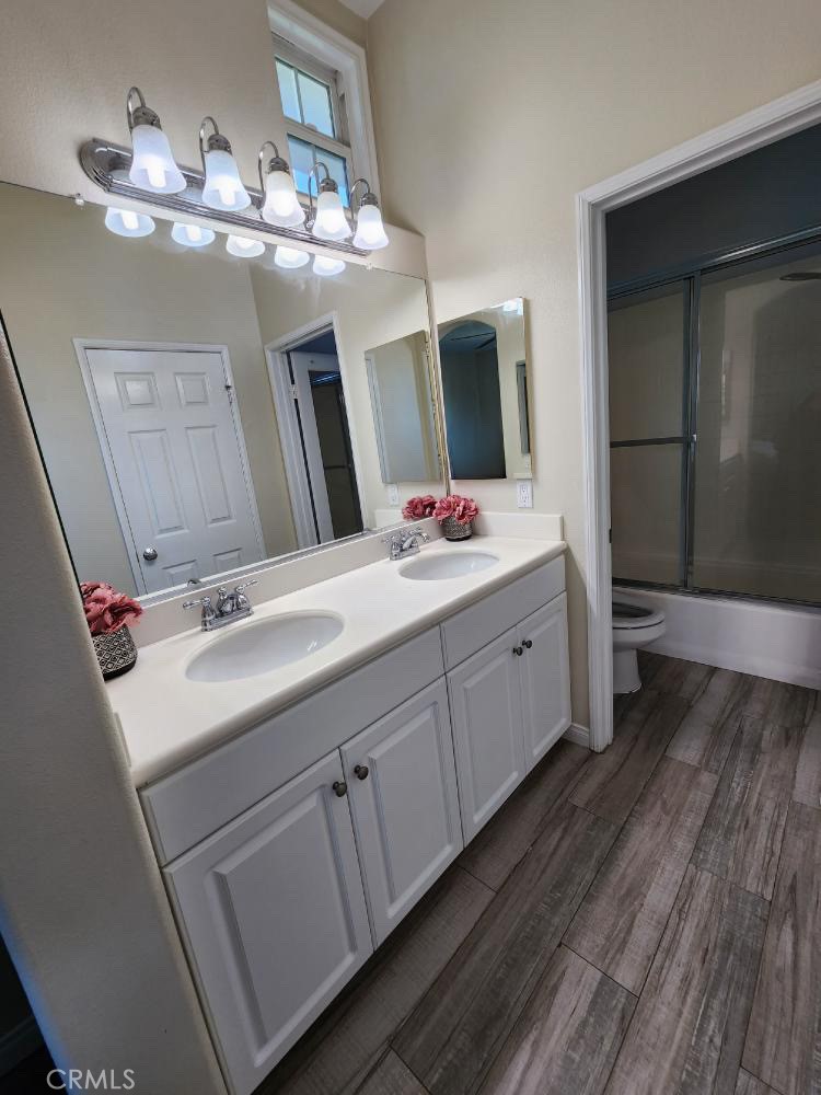 11040 Encanto Way El Monte, CA 91731 - Photo 15 of 17 a bathroom with a double vanity sink and mirror