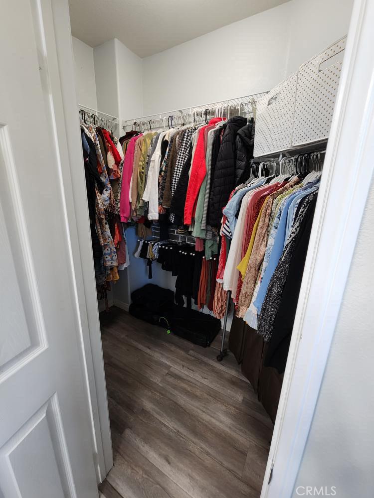 11040 Encanto Way El Monte, CA 91731 - Photo 16 of 17 a view of walk in closet with clothes and shoes