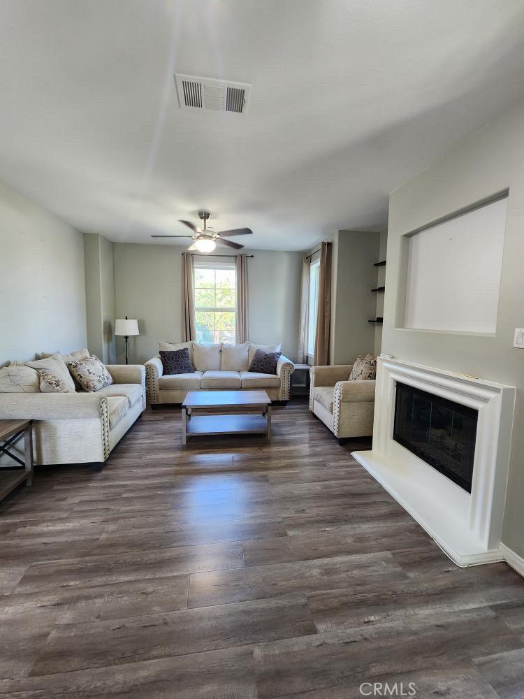 11040 Encanto Way El Monte, CA 91731 - Photo 4 of 17 a living room with furniture and a fireplace
