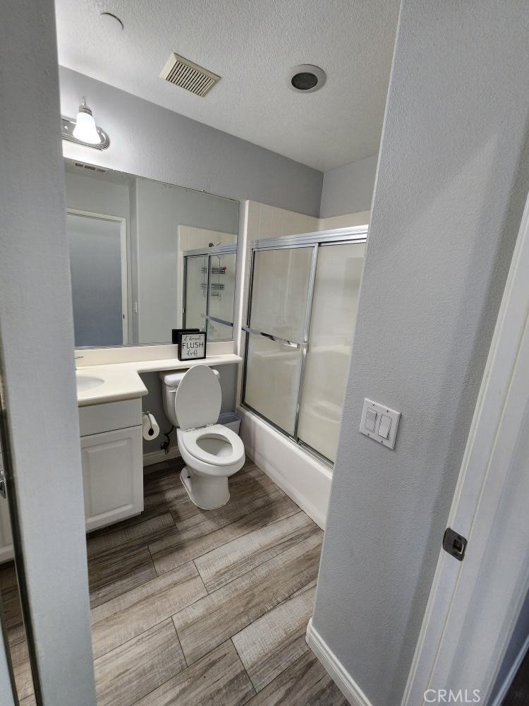 11040 Encanto Way El Monte, CA 91731 - Photo 8 of 17 a bathroom with a sink a toilet a mirror and shower