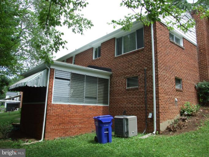2941 Terrace Drive Chevy Chase, MD 20815 - Photo 2 of 24 a front view of a house with garden