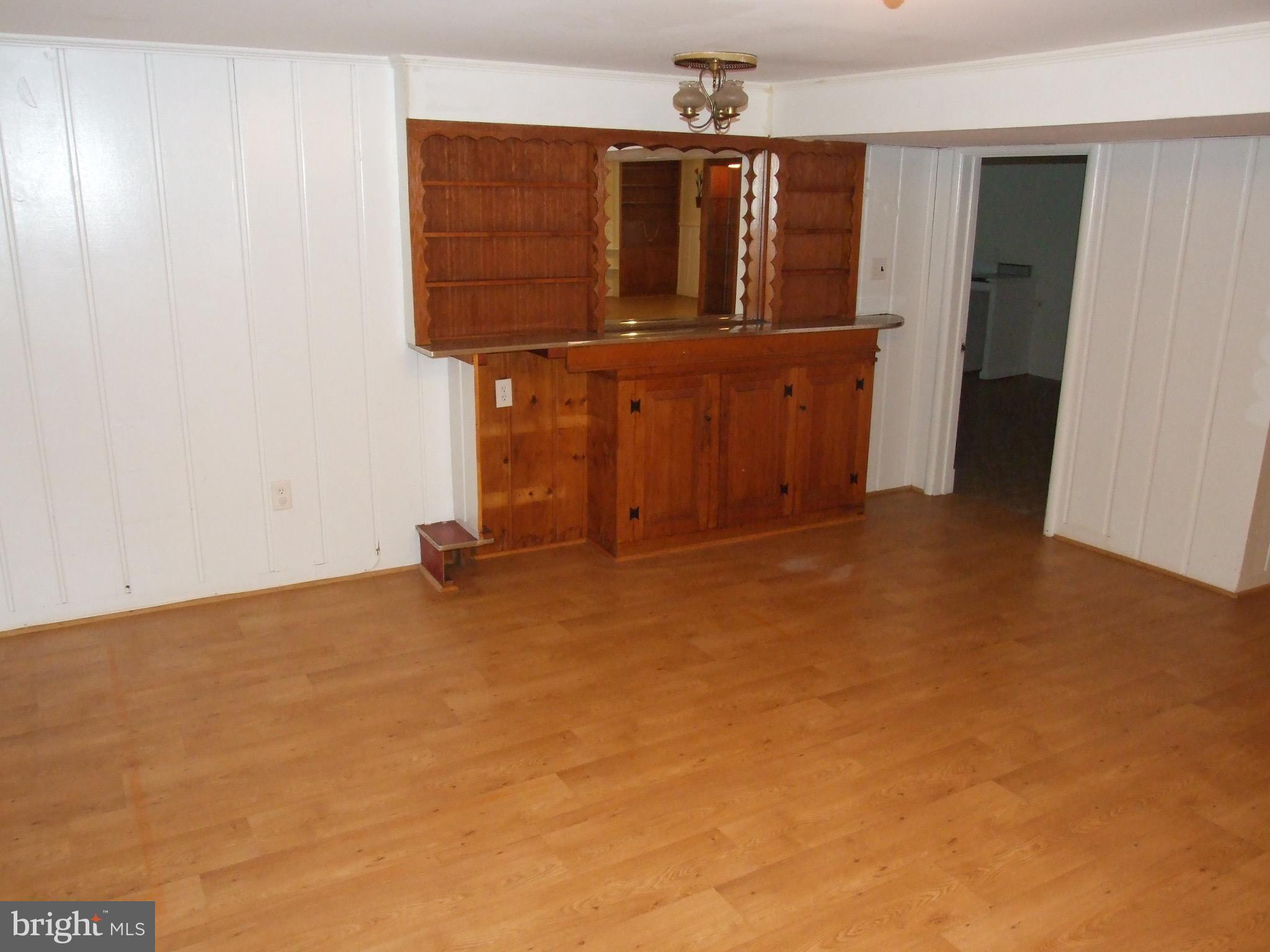 2941 Terrace Drive Chevy Chase, MD 20815 - Photo 16 of 24 an empty room with chandelier fan
